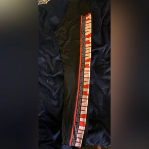 Black and Pink Victorias Secret Ultimate leggings.